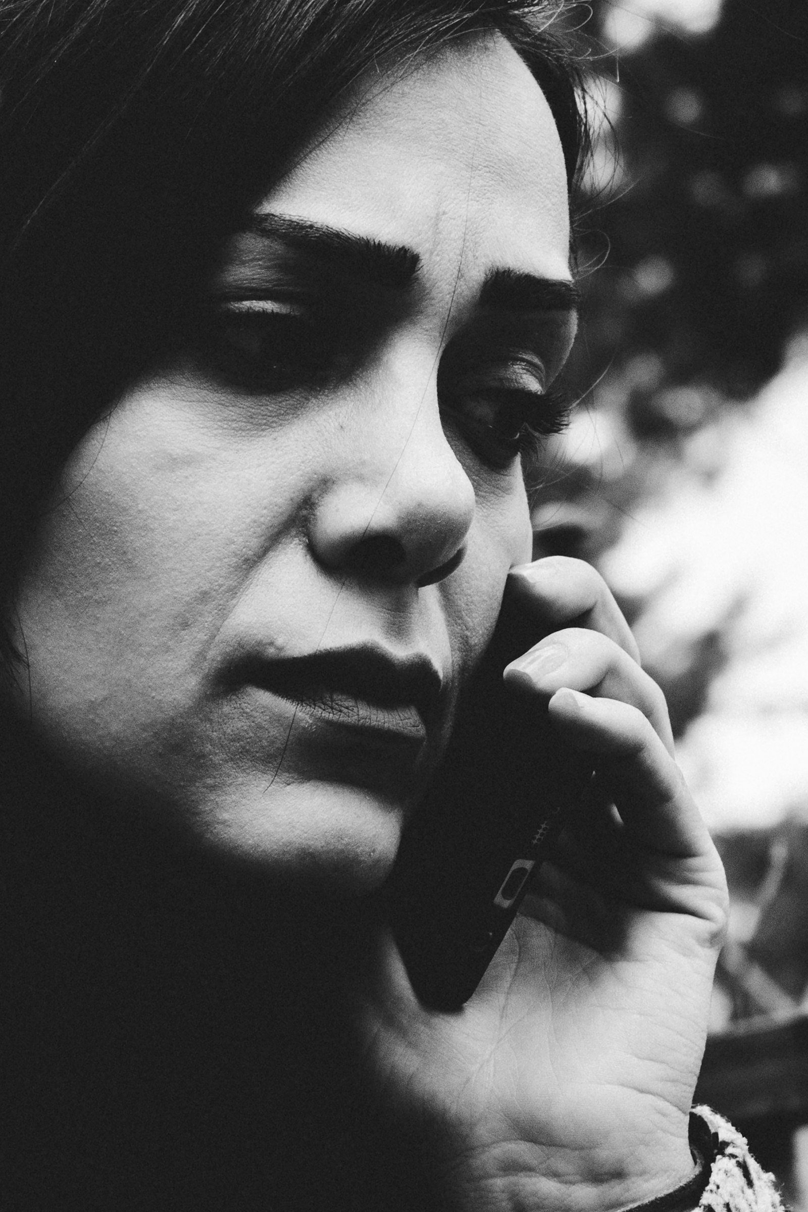 A worried woman on a phone call